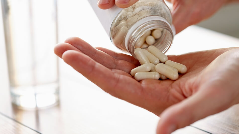 Capsules emptying into a hand